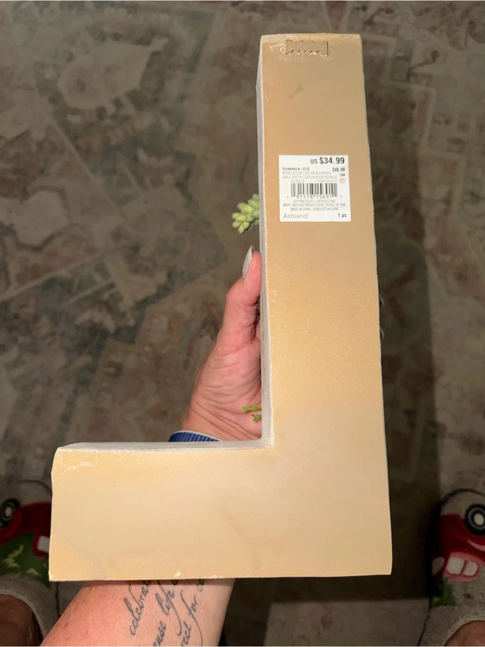Green L-Shaped Wall Planter with Green Succulent Accents.